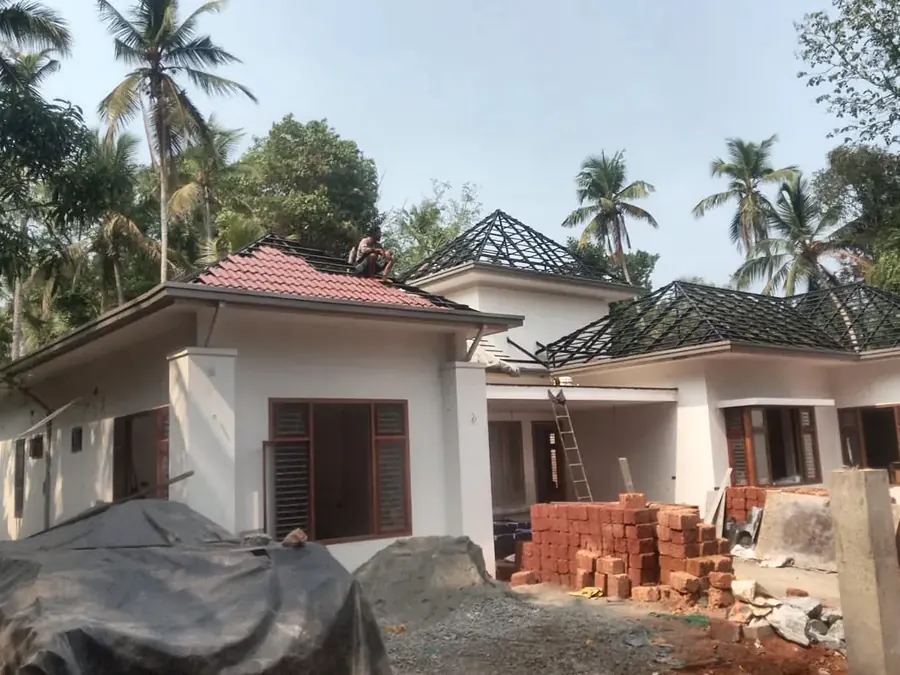 CSA Roof Works crew laying tiles on a Kerala house